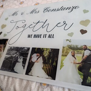 May include: A rectangular glass photo display featuring four wedding photos. The display includes the text "Mr & Mrs Constanzo" and "Together WE HAVE IT ALL" with decorative hearts in shades of green and brown.