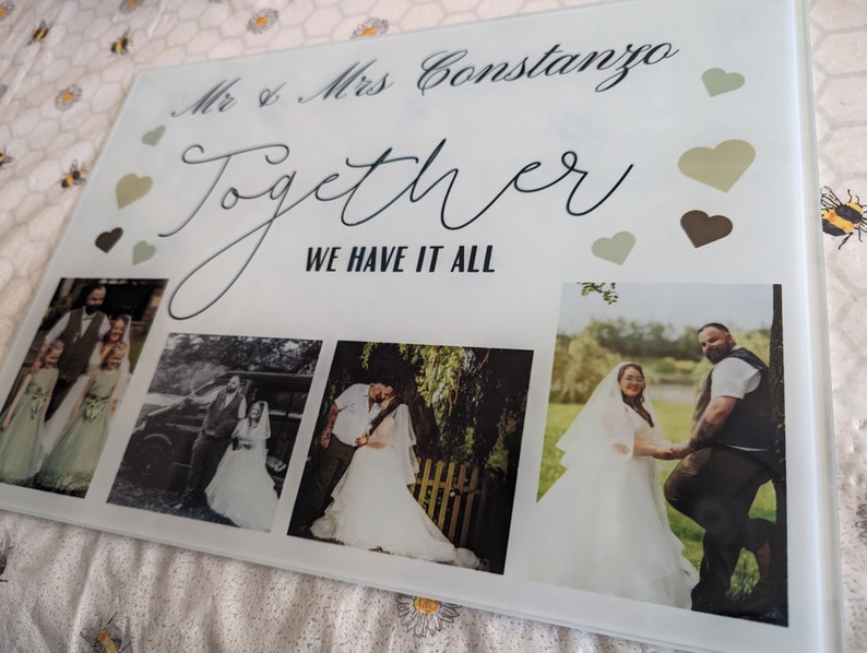 May include: A rectangular glass photo display featuring four wedding photos. The display includes the text "Mr & Mrs Constanzo" and "Together WE HAVE IT ALL" with decorative hearts in shades of green and brown.