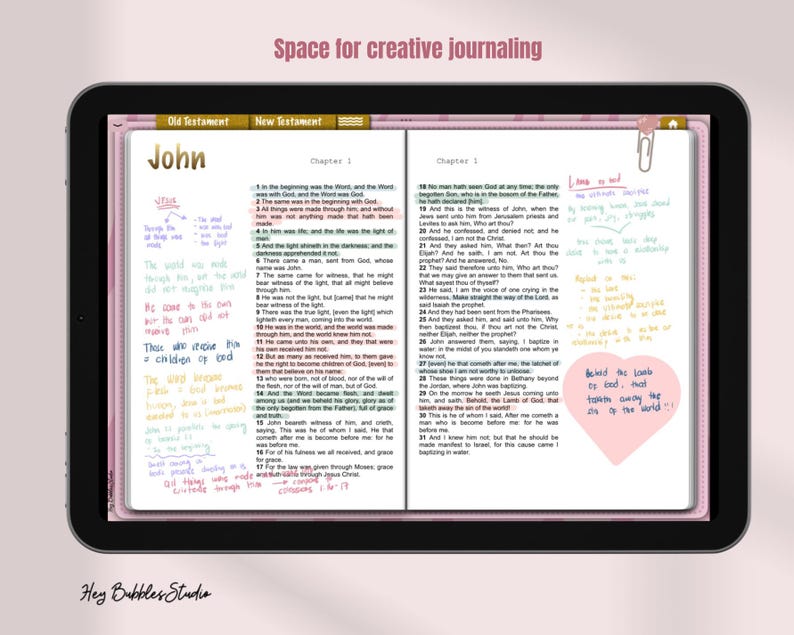 May include: A close-up of a digital tablet displaying an open Bible app with handwritten notes in various colours. The app is open to the book of John, chapters 1 and 18. The text "Those who receive Him are children of God" is written in pink on the left side of the screen. The text "Behind the lambs is God, and the Lambs carry the sins of the world" is written in blue on a pink heart sticker on the right side of the screen.