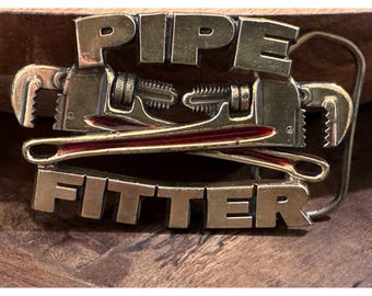 Vintage Pipefitter 1990 Belt Buckle Gold tone Red Embellishment Tools
