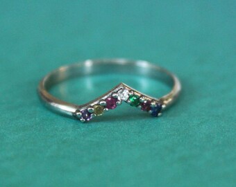 Dispersion 7 stone wedding band in 14K white gold with sapphires, emerald and amethyst