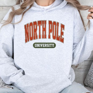 North Pole University Sweatshirt, Christmas Sweatshirt,North Pole Sweater,New Year Sweatshirt,Christmas Gift,Holiday Sweatshirt,College Gift