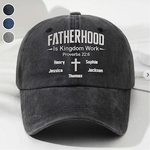 May include: A dark gray baseball cap with the word "FATHERHOOD" in white script. The text "-Is Kingdom Work- Proverbs 22:6" is below. The names Henry, Jessica, Thomas, Sophie, and Jackson are also printed on the cap.