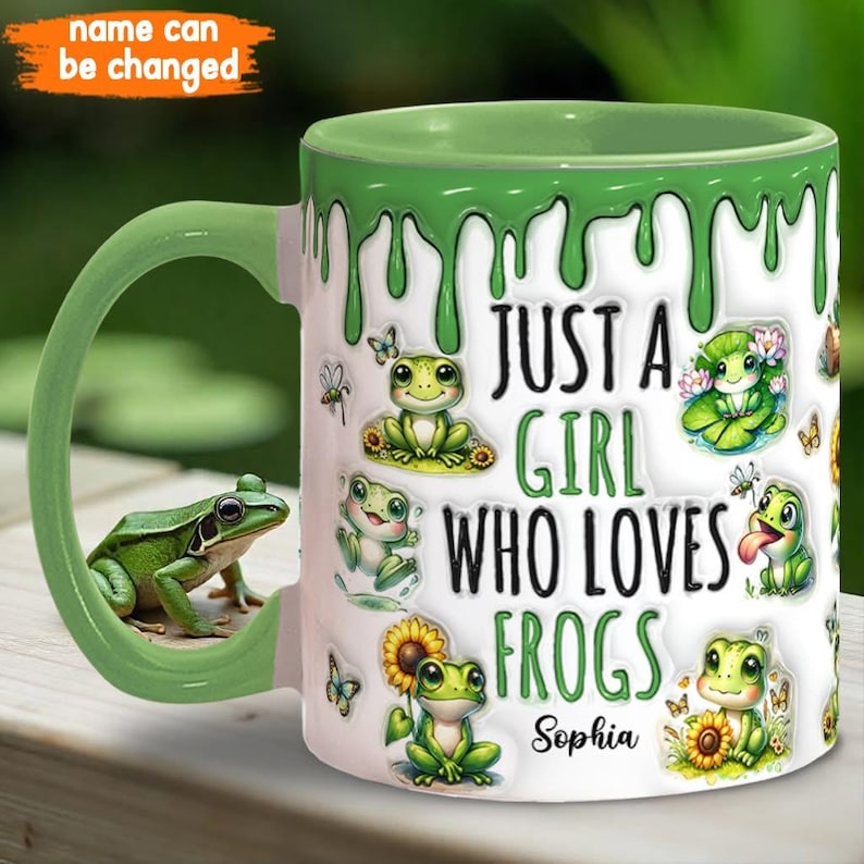 May include: A green and white ceramic mug with a dripping green glaze. The mug features a cartoon frog design and the text "Just a girl who loves frogs" with a personalized name.