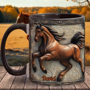 May include: A brown ceramic mug with a black handle features a 3D image of a brown horse with a white star on its forehead. The horse is running and has a white background with a brown ornate border. The mug has the name "David" printed on the bottom.