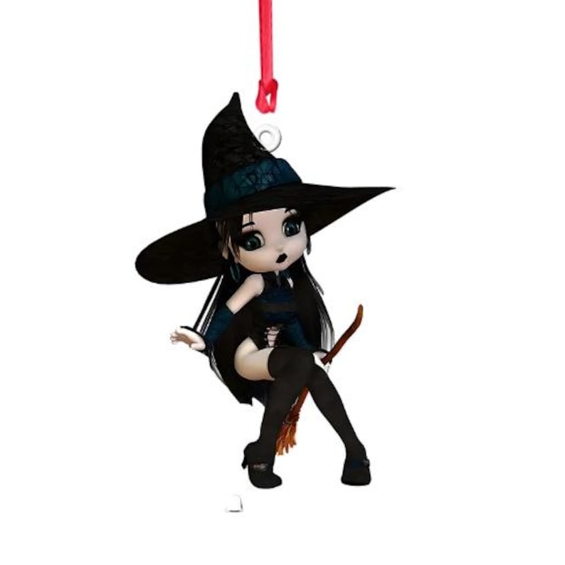 May include: A black witch doll with long black hair, wearing a black and blue dress, riding a broomstick. She is wearing a black witch hat with a red ribbon.