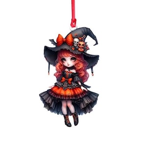 May include: A red-haired witch doll wearing a black witch hat with orange and black trim, a black and orange dress, and black boots. The doll is holding a small pumpkin in her hand.