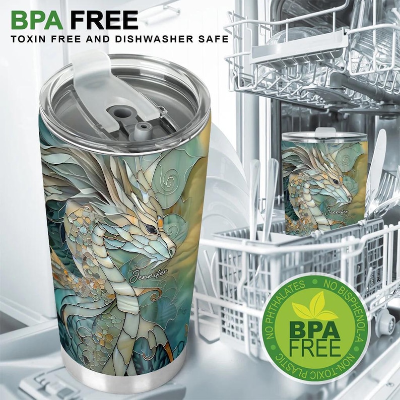 May include: A stainless steel tumbler featuring a colourful stained glass dragon design. The tumbler is BPA free and dishwasher safe. The text "BPA FREE" and "TOXIN FREE AND DISHWASHER SAFE" is printed on the tumbler. The text "Jennifer" is printed on the dragon's tail.
