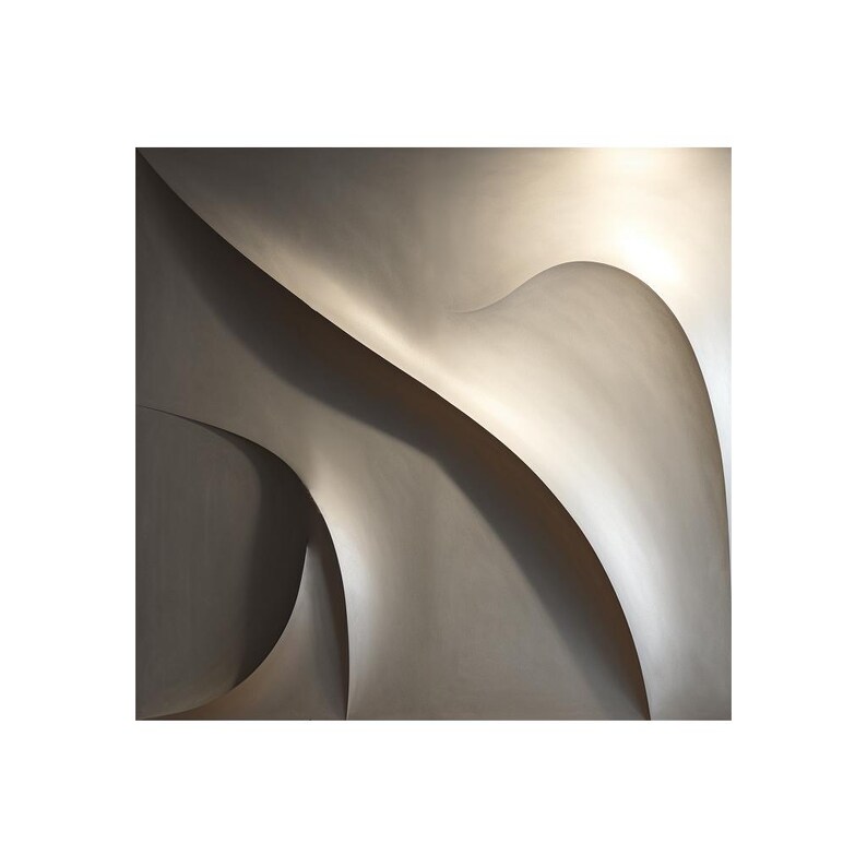 May include: Abstract wall art featuring a silver, metallic, three-dimensional design with curved lines and shadows.