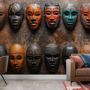 May include: A display of carved wooden masks in various colours and designs, mounted on a textured brown wall. The masks feature intricate details and are arranged in rows, creating a striking display. The room includes a desk, chair, and sofa.