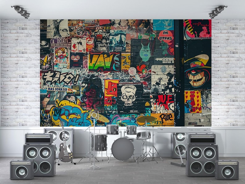May include: A music studio setup featuring a graffiti-covered wall backdrop with posters and artwork. The room includes a drum set, guitar, amplifiers, and speakers, creating a rock and roll theme.