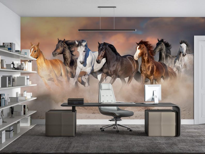 May include: A wall mural featuring a group of seven horses running through a field. The horses are brown, white, and black, and they are running in a line. The background is a blurry image of a field with a sunset in the distance.