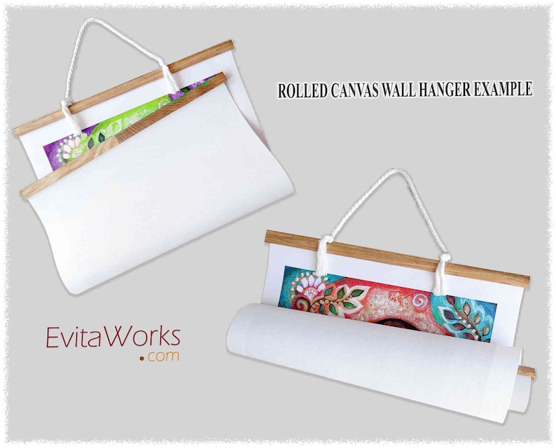 May include: Two examples of rolled canvas wall hangers with wooden dowels and white rope. The canvas is rolled up and secured with the dowel. The top of the dowel has a white rope attached to it for hanging. The canvas is white and the dowel is natural wood. The text "ROLLED CANVAS WALL HANGER EXAMPLE" is visible at the top of the image.