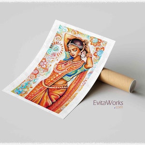 May include: A colorful watercolor print of a woman in traditional Indian attire. The artwork features a woman in a vibrant orange and blue sari, adorned with jewelry. The background has floral and paisley patterns. The print is leaning against a brown cardboard tube.
