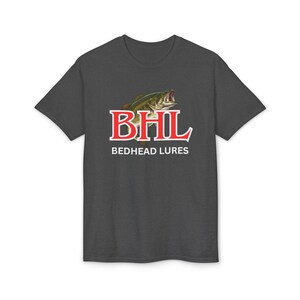 May include: Dark gray t-shirt featuring a graphic of a fish with the text "BHL BEDHEAD LURES" in red and white. The design is centered on the front of the shirt. The shirt is made of a soft, comfortable material.