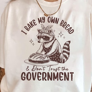I Bake My Own Bread & Don&#39;t Trust The Government Shirt, Funny Raccoon Shirt, Raccoon Baker, Raccoon Lover Gift, Sarcastic Raccoon Shirt
