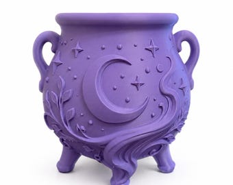 May include: A matte purple cauldron with two side handles and three legs. The exterior features embossed designs of a large crescent moon, scattered stars, small circular dots, and swirling leafy vine patterns wrapping around the base.