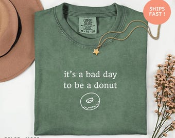 Camiseta "É um dia ruim para ser um donut" - Camiseta engraçada para quem ama donuts, presente de humor para quem gosta de doces, camiseta fofa com estampa de comida, camiseta engraçada