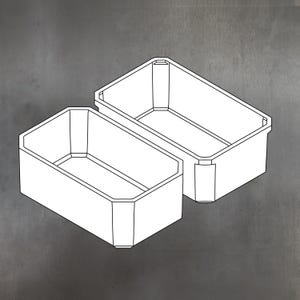 May include: Two white rectangular storage containers with a geometric design. The containers are empty and have a simple, modern aesthetic. The containers are set against a grey background.