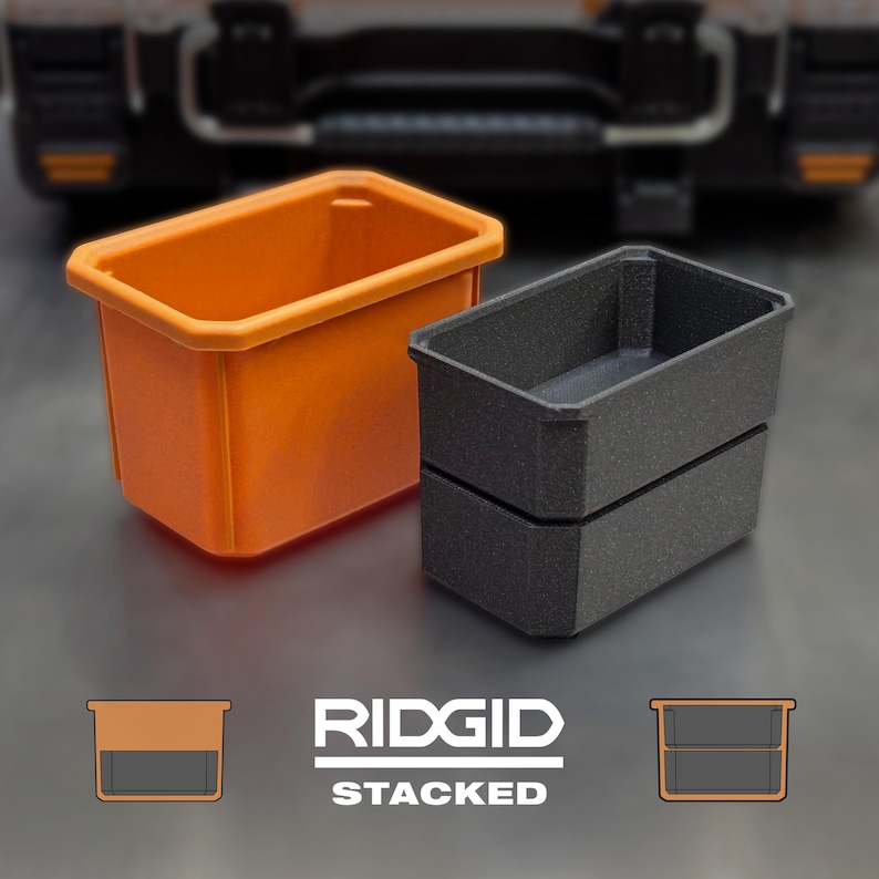 May include: Two plastic storage bins, one orange and one dark grey, are stacked. The orange bin is on the left, and the dark grey bin is on the right. The word "RIDGID" is printed in white, with "STACKED" below it.