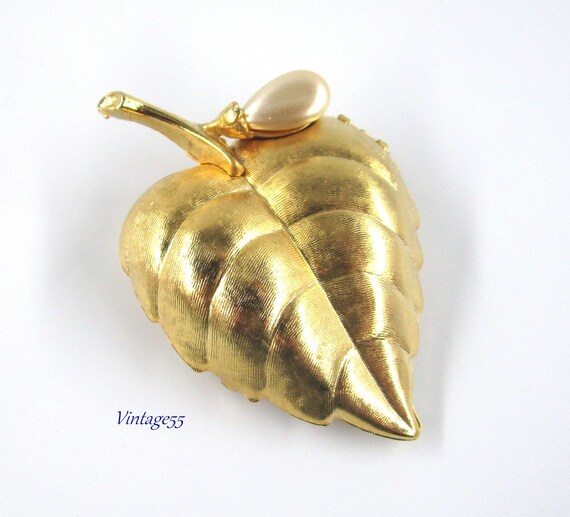 Avon perfume brooch hot sale