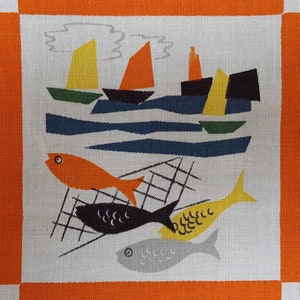 May include: A white fabric with an orange border features a stylized design of boats, waves, and fish. The boats are yellow, orange, and black. The waves are blue and white. The fish are orange, black, and gray.