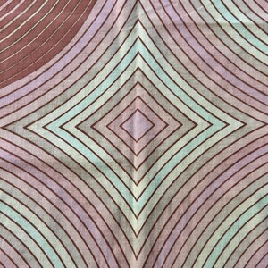 May include: A fabric with a geometric pattern of overlapping circles and diamonds in shades of brown, purple, and green.