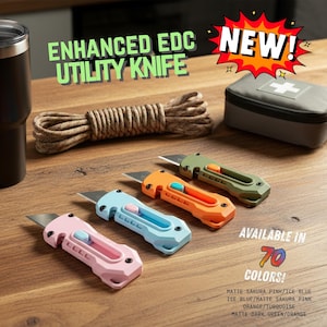 May include: A collection of EDC (Everyday Carry) items, including a black tumbler, flashlight, rope, first aid kit, and four utility knives in pink, blue, orange, and green. The image includes the text "ENHANCED EDC UTILITY KNIFE" and "NEW!" and states the knives are available in 70 colors.