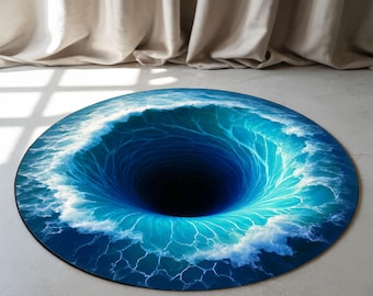 May include: Round rug with a digitally created image of a swirling ocean vortex. The rug features shades of blue and white, creating a 3D effect. The center is a dark hole, adding to the illusion. The rug is placed on a light-colored floor.