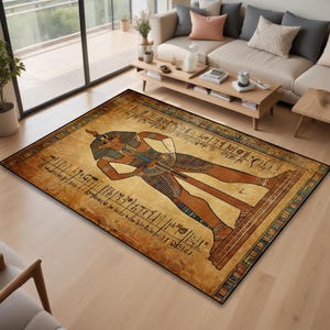 May include: An Egyptian-themed area rug with a brown background and a large illustration of an ancient Egyptian pharaoh holding a staff. The rug features hieroglyphics and a gold border.