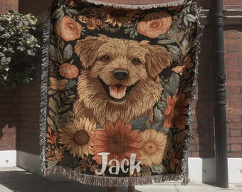 May include: A woven throw blanket featuring a central portrait of a golden-brown dog with a happy expression, surrounded by a dark background filled with orange and yellow sunflowers, roses, and butterflies, with the name Jack printed in white.