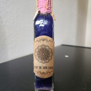Botella de poción para detener el reloj del envejecimiento