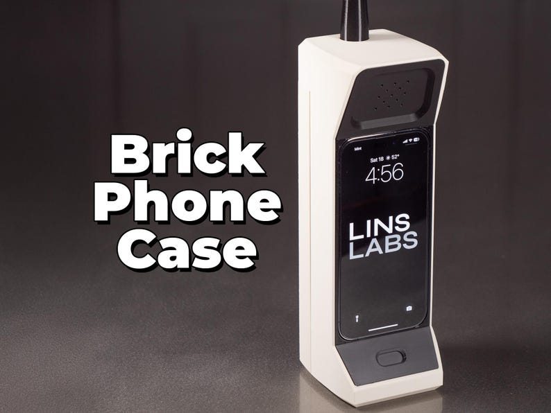May include: A white brick phone case with a black screen displaying the time 4:56 and the text "LINS LABS".