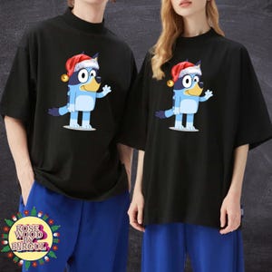 Christmas T-Shirt with Cute Cartoon Dog Design | Holiday Unisex Tee | Santa Hat Dog Shirt | Family Christmas Outfit