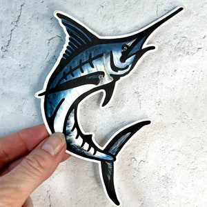 May include: A blue and black marlin fish sticker with a white outline. The marlin is jumping out of the water with its mouth open.
