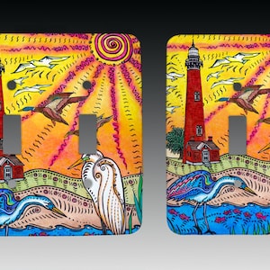 May include: A colorful light switch cover with a lighthouse, birds, and a sun in the background. The switch cover is decorated with a whimsical, hand-painted style.