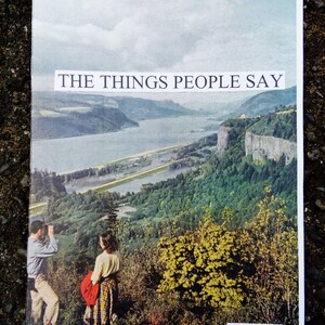 May include: A magazine cover with a scenic landscape photo of a river and mountains. The title of the magazine is "THE THINGS PEOPLE SAY" and the issue number is "#2".