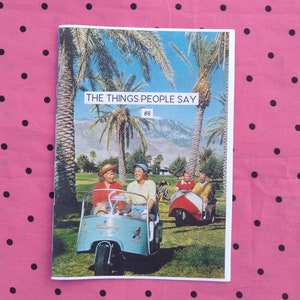 May include: A magazine cover with the title "The Things People Say" #8. The cover features a photo of a group of people in a golf cart driving through a palm tree lined golf course.