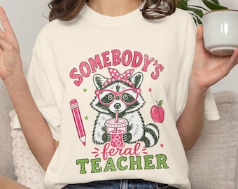 Somebodys Feral Teacher T-Shirt | Funny Raccoon Back To School Tee, Iced Coffee Teacher Cute Graphic Shirt, Elementary Educator Gift
