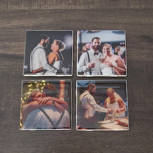 May include: A white ceramic mug with a black handle and the text "But First, Coffee" in a black, bold font. The mug is on a white surface.