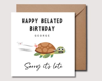 May include: A white card with black text that reads "Happy Belated Birthday George" and "Sorry it's late". A cartoon turtle with a sad expression is shown carrying a letter with a heart on it. The turtle is running away from a letter with a heart on it.