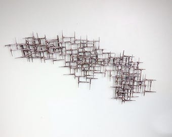 abstract brutalist bronze welded mid century inspired nail sculpture.