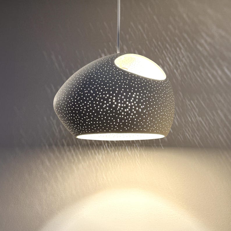 Claylight Pendant 12in. White Ceramic handmade perforated pendant light that casts light textures on ceiling and walls. UL listed Kitchen island light, by lightexture