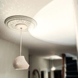 Claylight Pendant 12in. White Ceramic handmade perforated pendant light that casts light textures on ceiling and walls. UL listed Kitchen island light, by lightexture