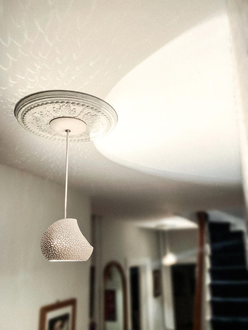 Claylight Pendant 12in. White Ceramic handmade perforated pendant light that casts light textures on ceiling and walls. UL listed Kitchen island light, by lightexture