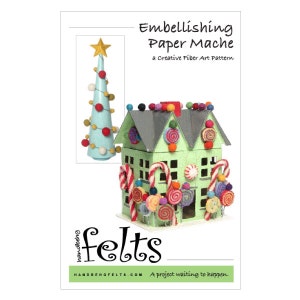 May include: A green paper mache house decorated with felt candy canes, lollipops, and swirls. The house has a white roof and is topped with a star. The text "Embellishing Paper Mache" and "felts" is visible on the image.