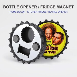 May include: A black and silver bottle opener and fridge magnet. The bottle opener has a gear-like edge and a silver center. The magnet features a yellow background with a picture of The Three Stooges and the text "ARRY CURLY REE STOOGES N TV!!".
