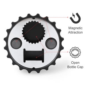 May include: A black and silver bottle opener with a magnetic attraction feature. The opener has a gear-like edge and a central opening for removing bottle caps. The design includes two magnets and the words "Open Bottle Cap".