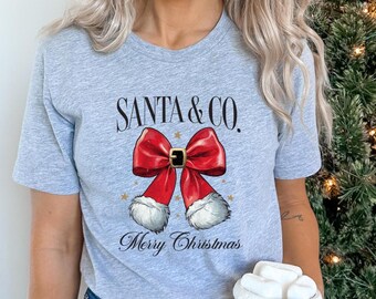 Santa Co Merry Christmas Shirt, Christmas Bow T-shirt, Cozy Holiday Tee,  Christmas T-shirt, Winter Party Outfit, Santa Christmas tee