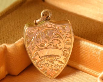 Medallón antiguo eduardiano chapado en oro con forma de escudo, colgante grabado de Thomas Hopwood, recuerdo heráldico inglés bicolor.